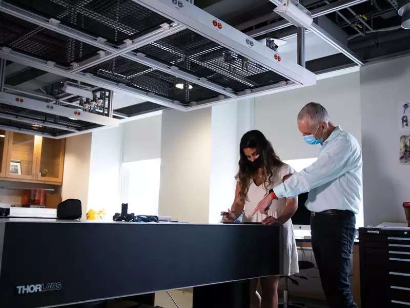 student and professor working together